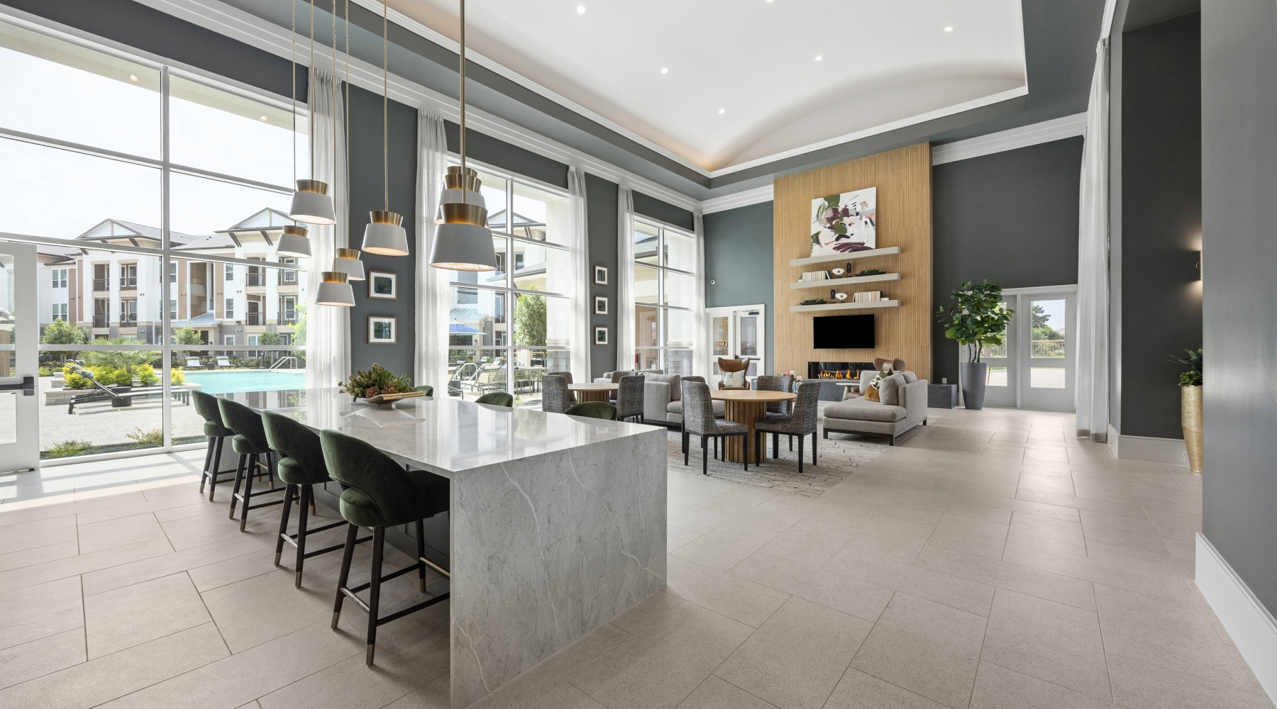 Open concept clubhouse with kitchen and fireplace
