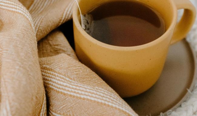 a cup of coffee on a blanket